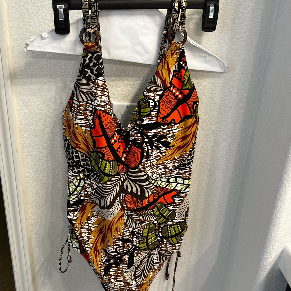 Brand new swimsuit size xl but is more like large tummy control.